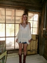 americana boots cowboy_boots gothic jean_shorts southern_gothic white_top woman